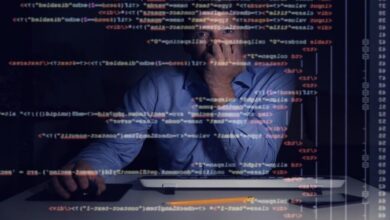 Programmer looking at code