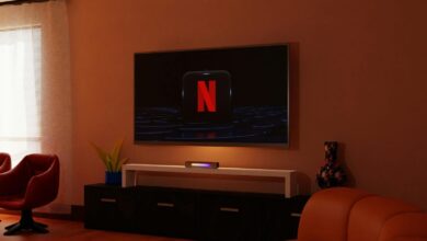 a living room with a flat screen tv on the wall