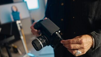 A man holding a camera in his hands