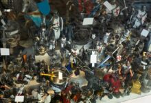 Multiple small action figures, like knights and horses, stuffed next to each other on a surface with multiple levels.
